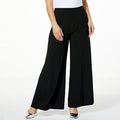 High-waisted black printed wide-leg pants on model - fashioncurb