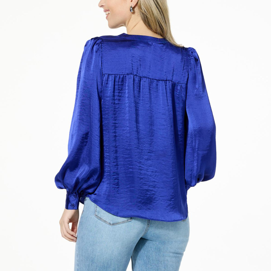 Front view of DG2 by Diane Gilman satin V-neck puff-sleeve blouse in royal blue, styled with light denim jeans.