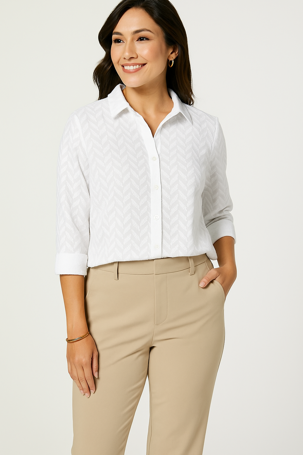 Jaclyn Smith Embroidered Cotton Voile Buttoned Shirt in Bright white, styled in a semi-formal look with beige high-waisted trousers, complemented by minimal gold accessories.